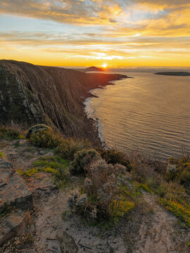 Epic sunrise golden light on the Waitpinga Cliffs at dawn over the ocean and horizon on the Fleurieu Peninsula in South Australia