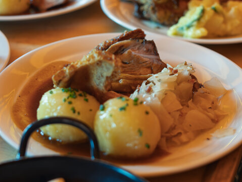 Hearty German Meal with Pork, Dumplings and Sauerkraut