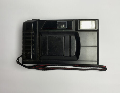 Vintage black analog film camera isolated on white background. retro photography.