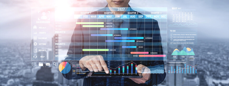 Business Professional Using Digital Gantt Chart for Project Management in Modern Office Setting with City View in the Background Fluxor.