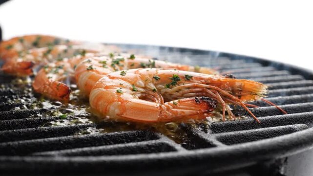 Fresh prawns cooking on a hot charcoal grill with steam rising from the metal grates with surface shellfish sizzle captures close seasoned video captures