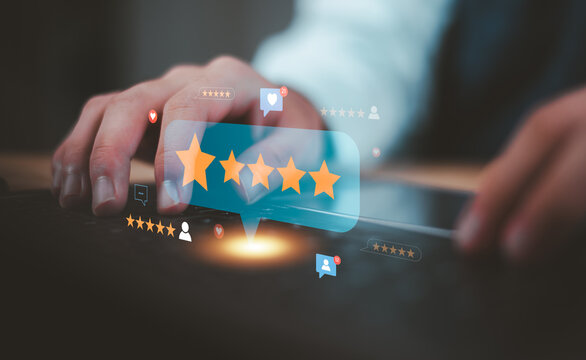 Marketing manager analyzes customer reviews ,five star ratings to measure customer satisfaction, online reputation, service quality, consumer feedback, social proof, brand trust, customer experience.