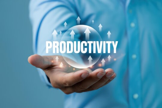 Businessman holding a glowing glass sphere with the word productivity and rising arrows representing business efficiency and growth in a corporate setting