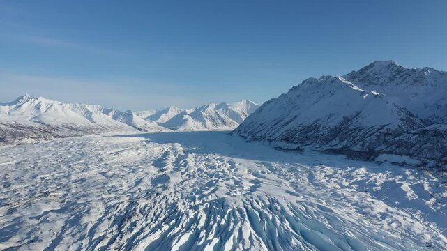 Wide Aerial View of Extensive Polar Glacier Field and Mountain Peaks