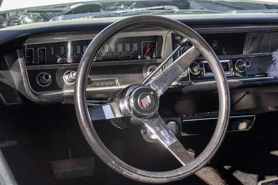 1967 Buick Skylark car interior with vintage dashboard and steering wheel in Michigan vintage car show.