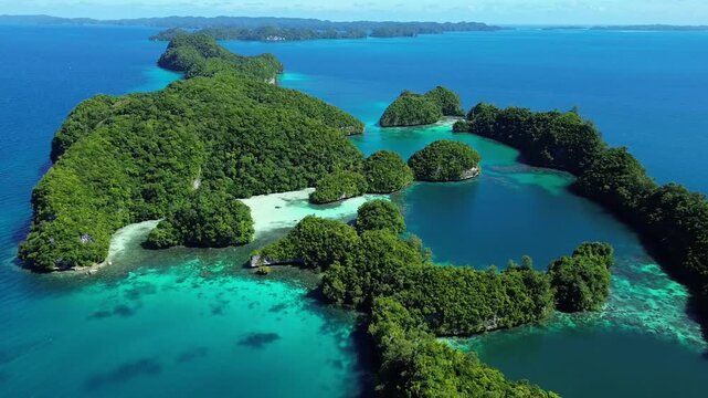Cinematic aerial footage of tropical rock islands, white sandbar and turquoise lagoon in Palau