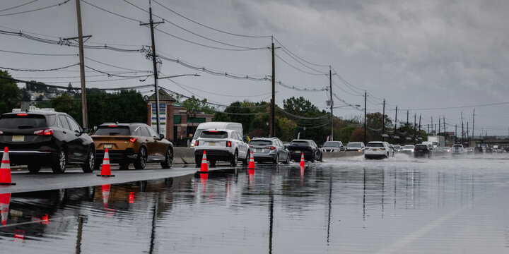 Traffic Congestion and Vehicles Driving on a Flooded Highway During Extreme Weather Storm