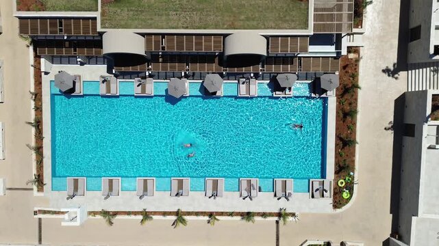 Swimming pool at mediterranean holiday resort, Nana Royal Premium resort and Spa, Crete, Overhead aerial view