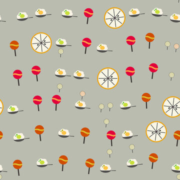 Pattern of fried eggs, lollipops, and citrus slices