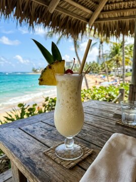 Pi?a Colada on Table at Tropical Beach Bar