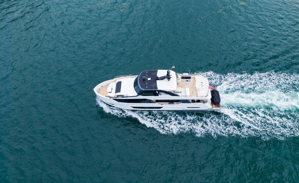 Luxury boat yachting. Motorboat sailing at sea. Luxury private yacht in sea. Motor yacht luxury vessel. Boat motor aerial. Vacation on summer. Aerial view on motorboat. Yacht boat tour