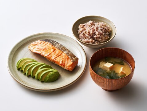 Japanese breakfast,grilled salmon with avocado  and  multigrain rice, miso soup