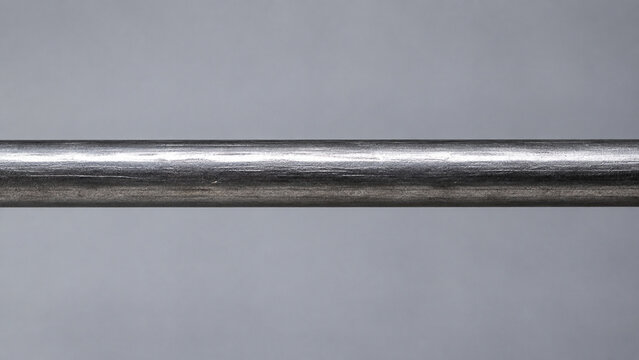 Rigid metal rod on gray background, industrial strength and fixed support concept