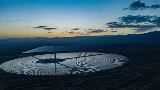 Molten salt tower solar thermal power plant at sunrise, new energy source, super mirror power plant, prism tower