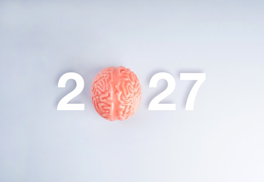 Brain model replaces the zero in 2027, representing cognitive health, mental wellness, neuroscience, healthy aging, preventive care and future healthcare planning for the coming year concepts.