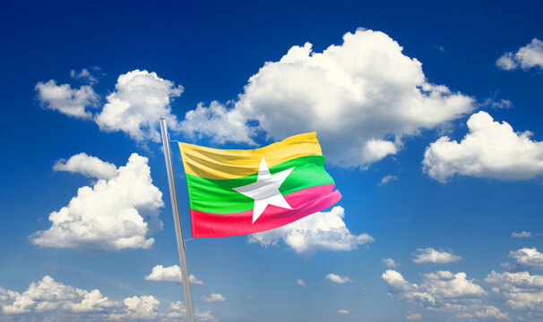 Myanmar (Burma) national flag waving with skyline and buildings. Myanmar Burma national flag for independence day.