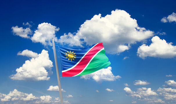 Namibia national flag waving with skyline and buildings. Namibia national flag for independence day.