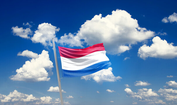 Netherlands national flag waving with skyline and buildings. Netherlands national flag for independence day.