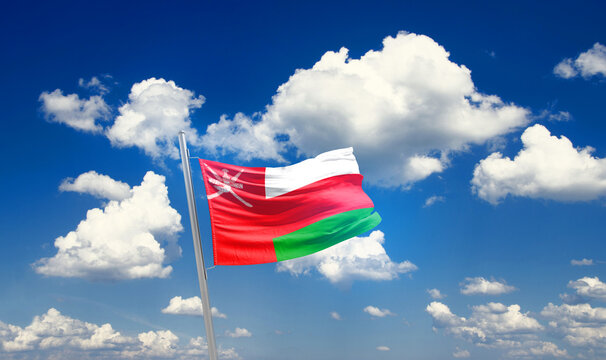 Oman national flag waving with skyline and buildings. Oman national flag for independence day.