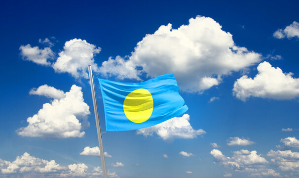 Palau national flag waving with skyline and buildings. Palau national flag for independence day.