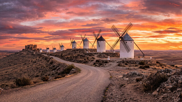 Vertical view of historic windmills in spain at dusk