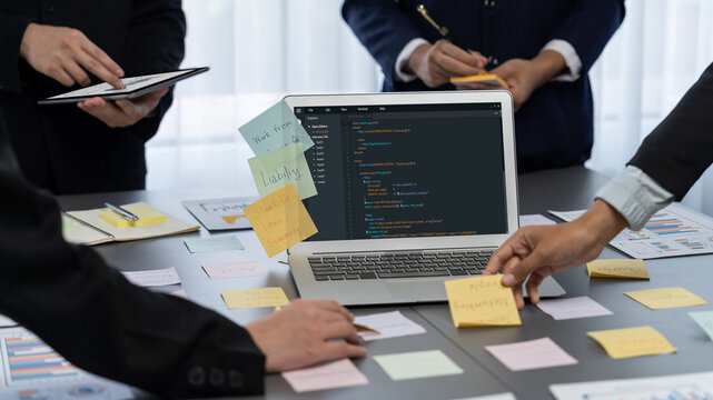 Analyst team use sticky note for creative and analytic brainstorm for business idea with BI data dashboard on laptop screen. Analysis financial data visualization tech for marketing strategy. Prodigy