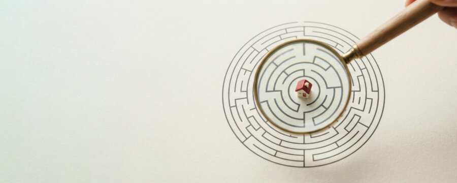 Affordable housing challenge depicted through maze and wooden tool suggesting complex planning and thoughtful urban development