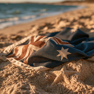 Australian flag on sandy beach with starfish in warm sunlight