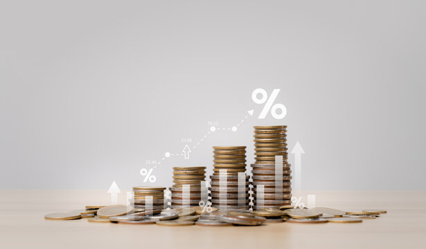 Financial growth and interest rate concept with stacked coins, percentage symbols and rising chart showing investment return, savings growth, profit increase and wealth strategy