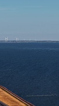 Aerial view of Windpark Frysl&acirc;n and Afsluitdijk highway in the IJsselmeer lake, Netherlands