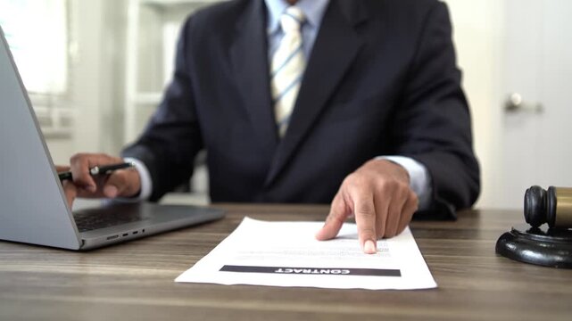 Lawyer reviewing legal documents and contracts, consulting clients on justice, legislation, court proceedings, government decisions, agreements, finance, and 