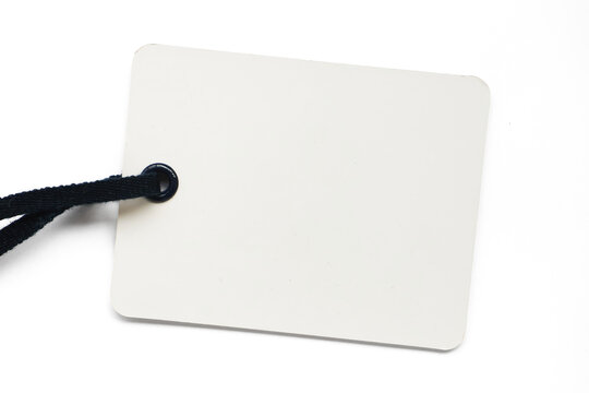 Blank beige paper tag with textured surface and twine string