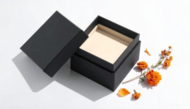 Elegant Halloween minimalist black open gift box mockup for luxury jewelry display with dried orange marigold flowers on a clean white surface