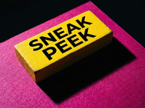 Yellow wooden block with sneak peek text on pink surface suitable for marketing campaign teasers symbolizing anticipation preview and curiosity