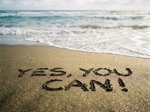 Motivational phrase written in sand on an ocean beach ideal for self improvement and success content symbolizing positivity and self belief