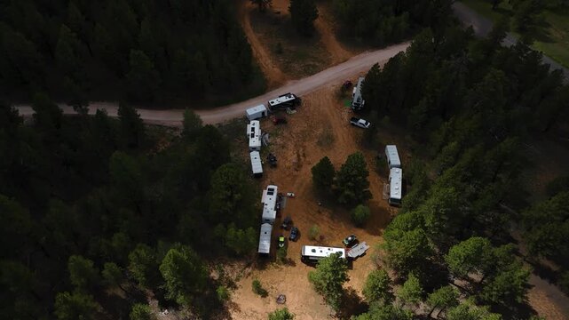 Aerial Drone Reveal of RV Campers Ring in Utah Mountain Pine Forest