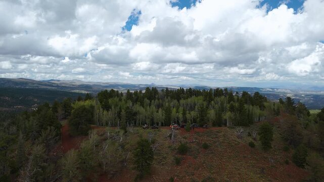 Drone Flyover of Red Rock Mountain Cliffs and Pine Trees in Utah