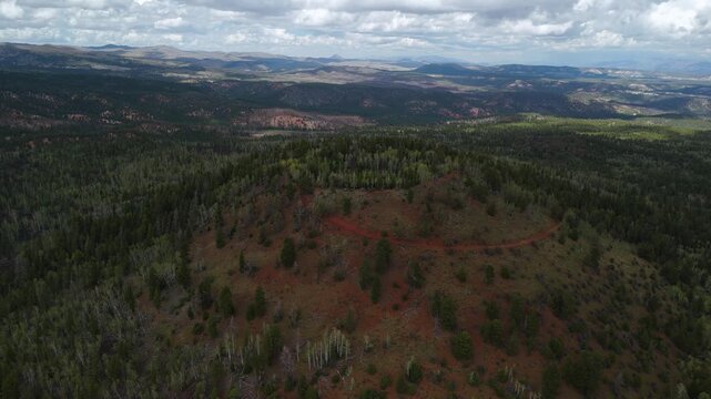 Drone Flyover of Red Rock Mountain Cliffs and Pine Trees in Utah