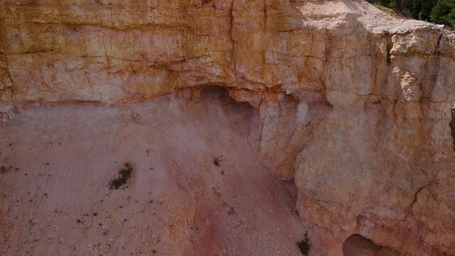 Aerial View of Red Rock Canyon Cliffs and Pine Forest in Utah
