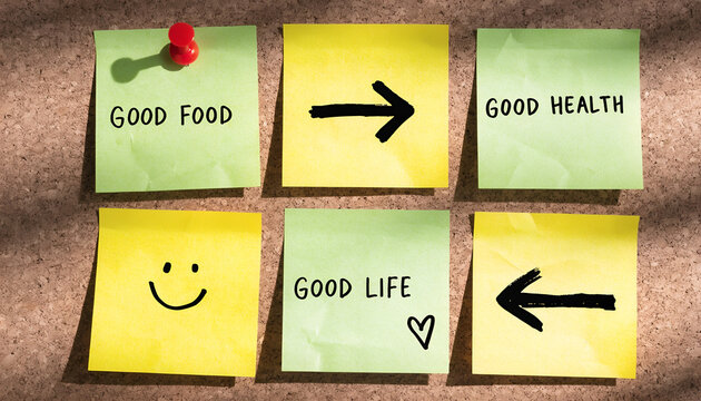 Good Food, Good Health, Good Life Concept with Colorful Sticky Notes on Corkboard