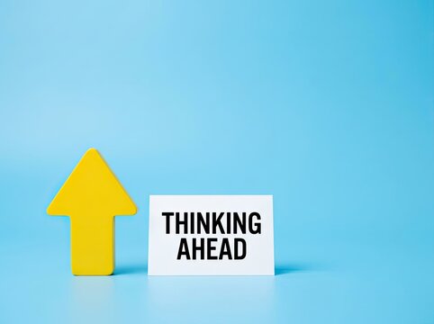 Yellow upward arrow next to thinking ahead sign on blue background ideal for business strategy content symbolizing future vision and progress