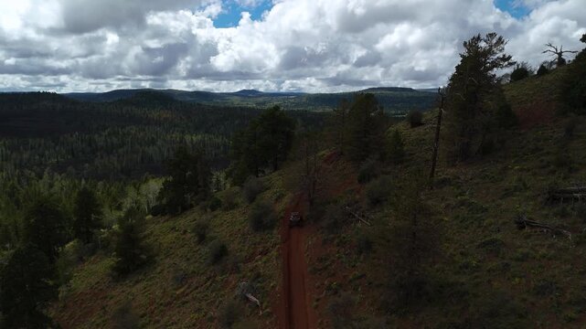 Aerial Drone View of UTV Off-Road Vehicles Driving up Mountain Trail Utah