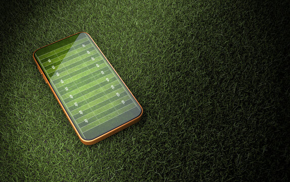 Mobile phone on green grass with American football field layout on screen,3d rendering