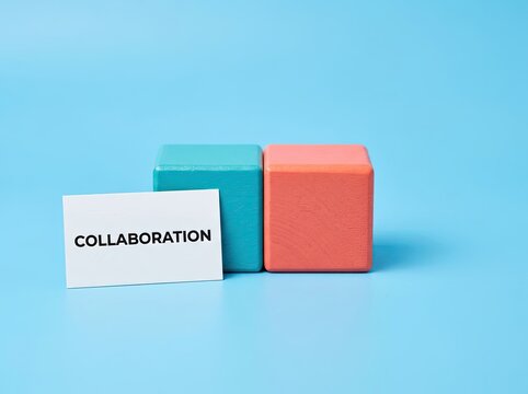 Colored wooden blocks next to a collaboration sign suitable for corporate media symbolizing teamwork partnership and strategic unity