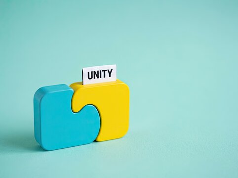 Connected blue and yellow puzzle blocks with a unity tag suitable for business presentations symbolizing teamwork integration and strength