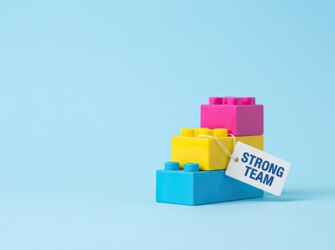 Stacked colorful plastic blocks with tag suitable for business presentations symbolizing unity collaboration and strong team foundation