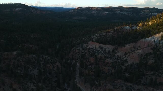 Drone Flyover of Red Rock Mountain Cliffs and Pine Trees in Utah