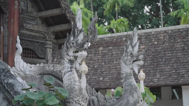 Stucco naga serpent statues guarding a Lanna temple stairway