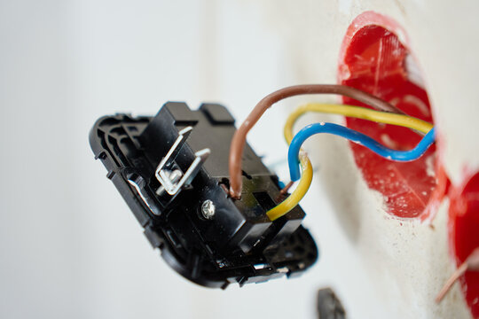 Electrical outlet connected to wires during installation