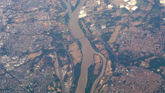 Flying High Over City of Nantes in France with Loire River Flowing Through with Buildings and Roads.